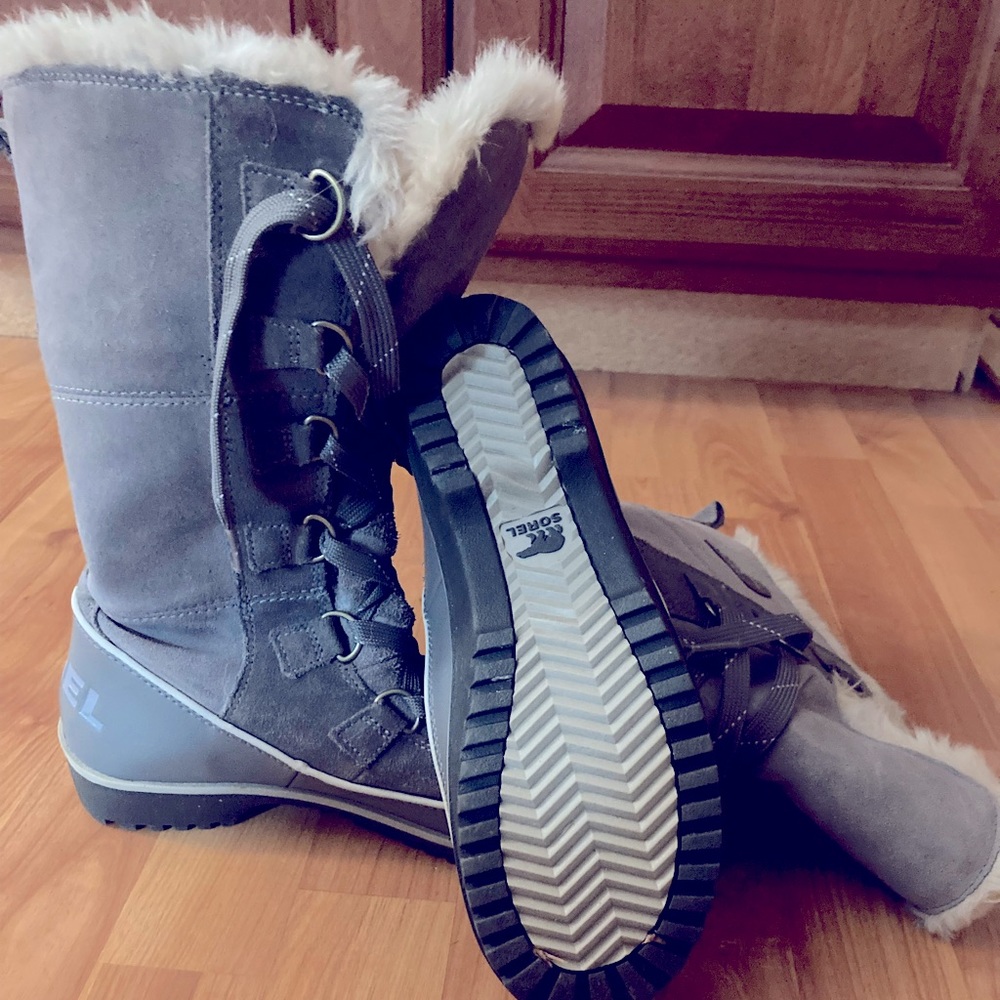 SOREL winter boots with faux fur cuff.